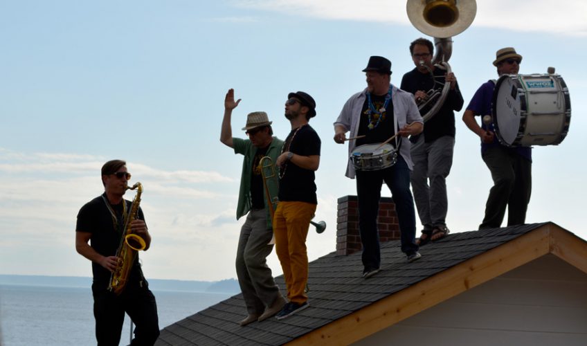 Band playing on the roof of The Western Oracle at the installation opening, Seattle Art Museum sculpture park. 