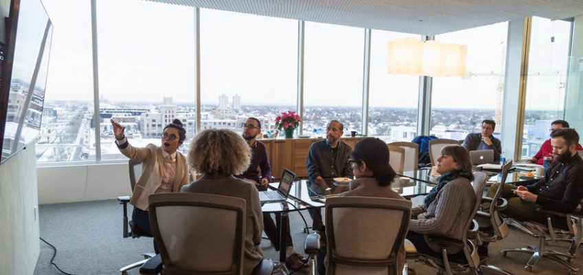 A group of ES students gives a presentation to their client, Velasquez Family Coffee, at mono. Photo courtesy MCAD.